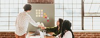 Happy businesswomen doing a handshake