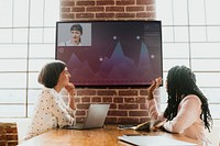 Diverse colleagues having a conference through a tv screen