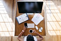 Businesswoman working in office with digital devices