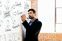 Man writing on a white board