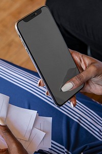 Woman paying bills online via internet banking