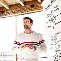 Man writing on a white board