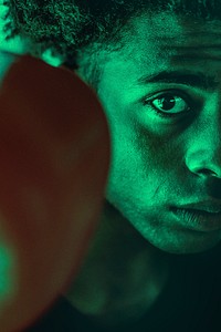 Half-face portrait of boxer in green