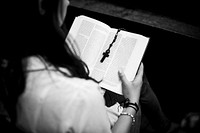 Woman reading from the Holy Bible