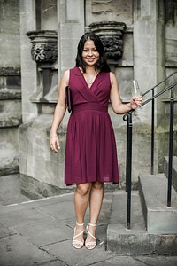 Successful woman in a burgundy dress
