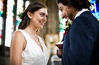 Happy bride and groom at the altar