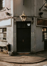 Closed black doors of an old building in downtown Bristol, UK