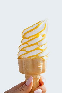 Soft serve ice cream cone with caramel sauce design element