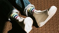 High top white sneakers on model casual style