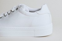 Woman's white canvas sneaker mockup on white