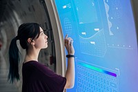 Girl coding on a interactive screen