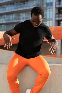Sportswear black t-shirt mockup psd with orange pants cool men&rsquo;s fashion