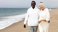 Happy senior couple relaxing at the beach in winter