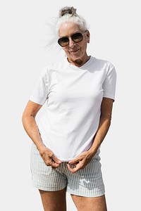Senior woman in white tee isolated on blank background