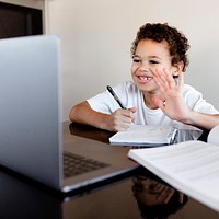 Boy studying from home in an online classroom in the new normal