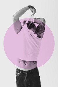 Man taking off white tank top with pink round badge