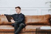 Man using a tablet and working from home