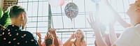 People playing with balloons at a party landscape banner 