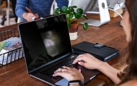 Businesswoman using a laptop in a meeting