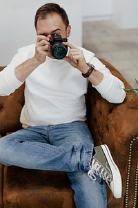 Photographer  sitting on the couch working