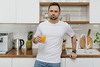 Man with an orange juice in his hand