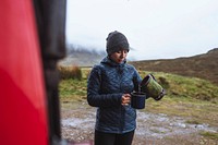 Woman pouring boiling water into a mug