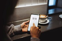 Woman in a cafe using her mobile phone