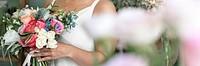 Bride carrying a beautiful flower bouquet