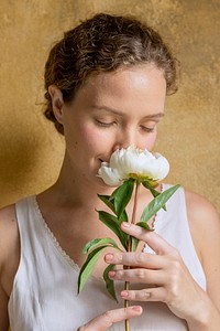 Woman with a white paeonia snowboard flower