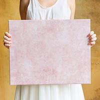 Woman showing a blank canvas