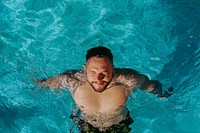 Man floating in a pool