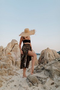 Woman at a rocky beach
