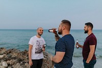 Guys having beers at the beach