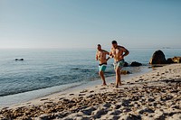 Men jogging alone the beach in the morning