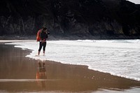 Female photographer at Plemont Bay, Isle of Jersey