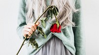Emotional woman with a red rose background