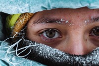 Closeup of a female mountaineer in wintertime at Glen Coe, Scotland