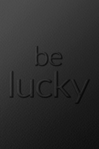 Be lucky message embossed typography on paper texture