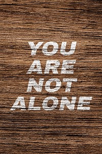 You are not alone wood texture typography printed lettering