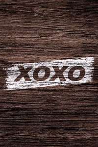 XOXO text typography dark wood texture
