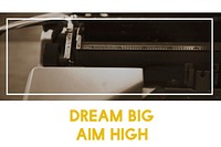 Dream Big Aim High on Typewriter Background