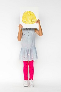 Child with a drawing of engineer safety helmet