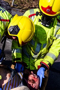 Firefighter rescuing patient, February 14, 2019, Cheshire, UK. Original public domain image from Flickr