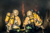 Firefighter team, extinguish tank. Original public domain image from Flickr