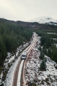 Drone shot of a snowy road in the Trossachs, Scotland