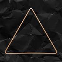 Triangle gold frame on a crumpled black paper textured background