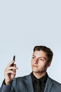 Young businessman holding stylus smart technology