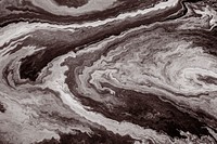 Brown fluid art marbling paint textured background