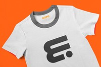 White t-shirt, abstract geometric logo on orange background