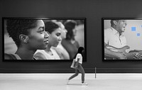 Woman walking in art exhibition
